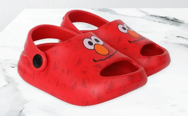 Ground Up Sesame Street Baby Comfort Clog Sandals in Elmo Style on the Table