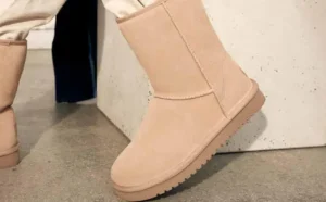 A Woman Wearing Koolaburra by UGG Classic Short Winter Boots