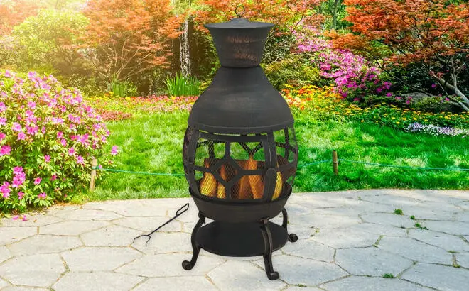 Better Homes Gardens Wood Burning Cast Iron Chiminea in the Yard