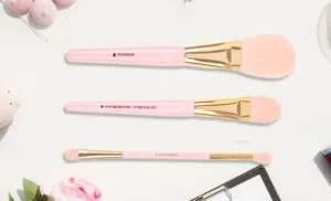 Too Faced 3 piece Makeup Brush Set on a Table